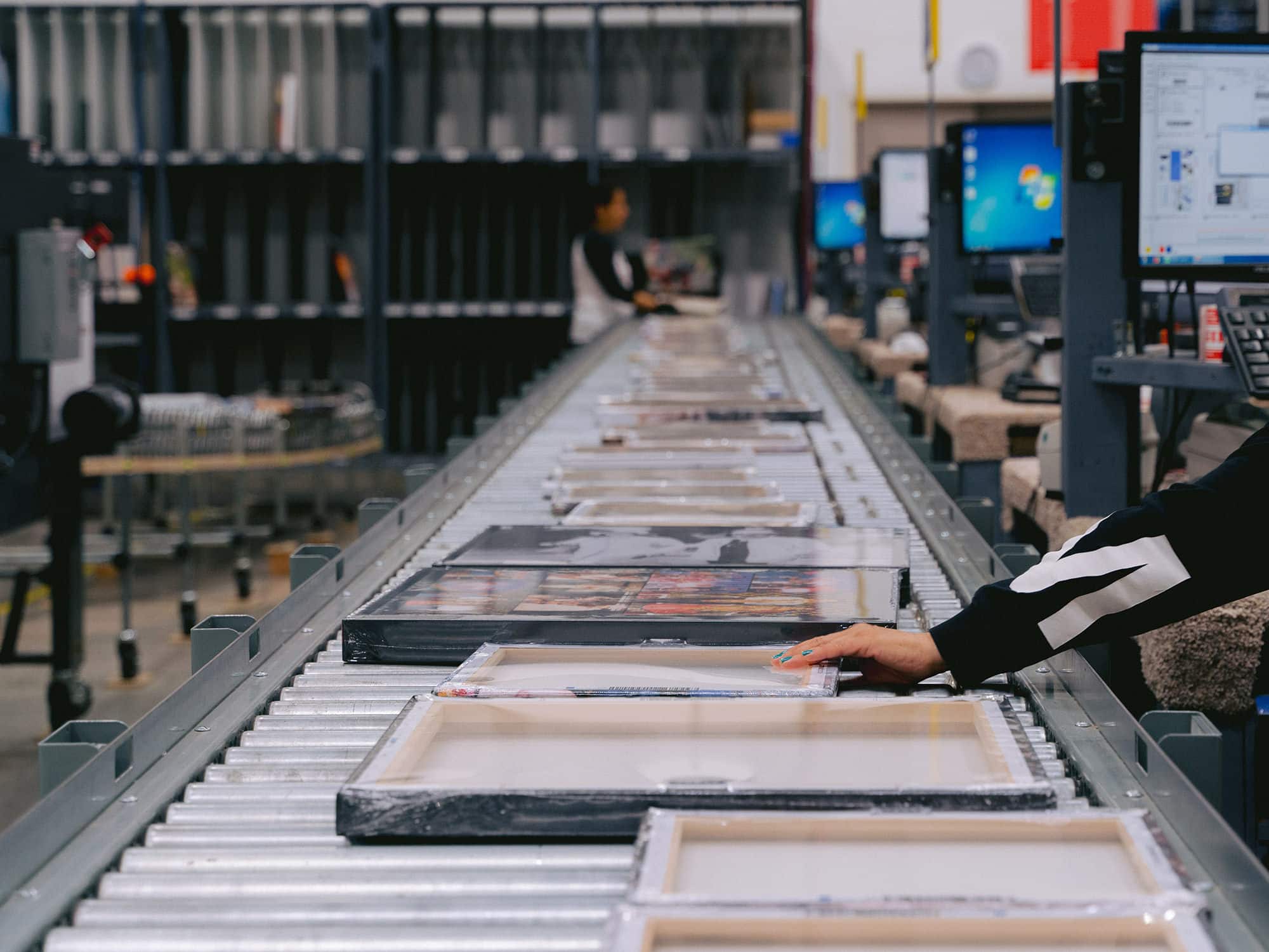 canvas prints roll down a production line