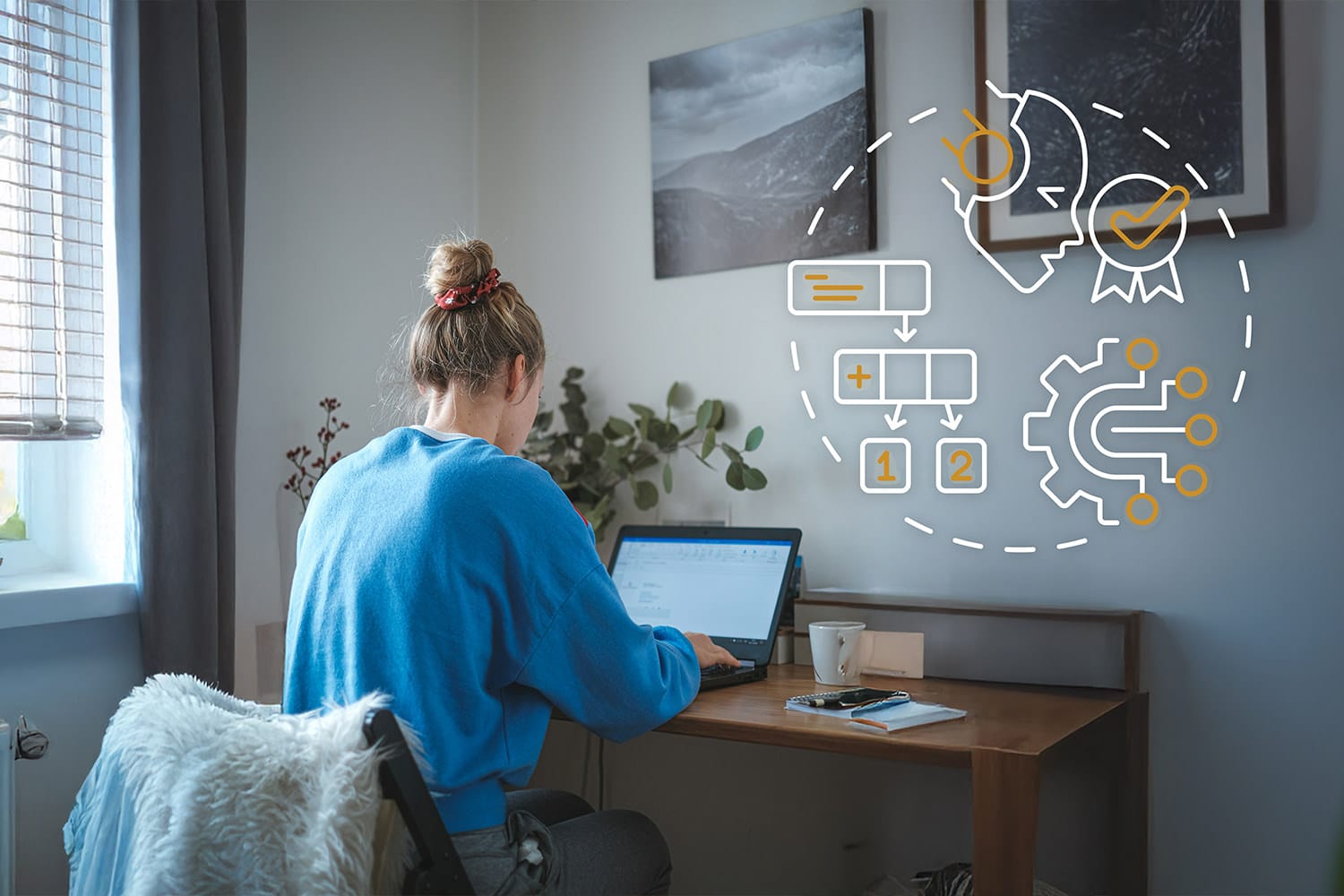 woman works on her computer at a desk